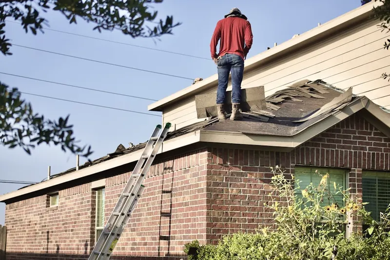 Professional roofer working on a residential roof in Contra Costa Centre